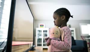 girl watching TV up close