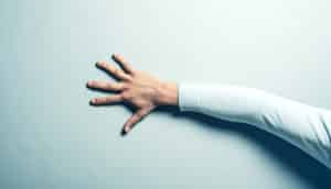 hand flat against wall