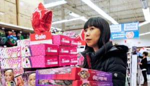 woman shopping for barbies - gift cards concept