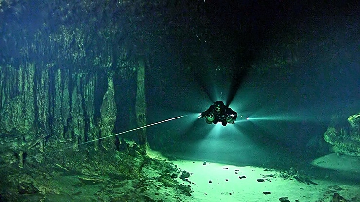 diver in cave finding methane microbe