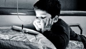 kid watching iPad