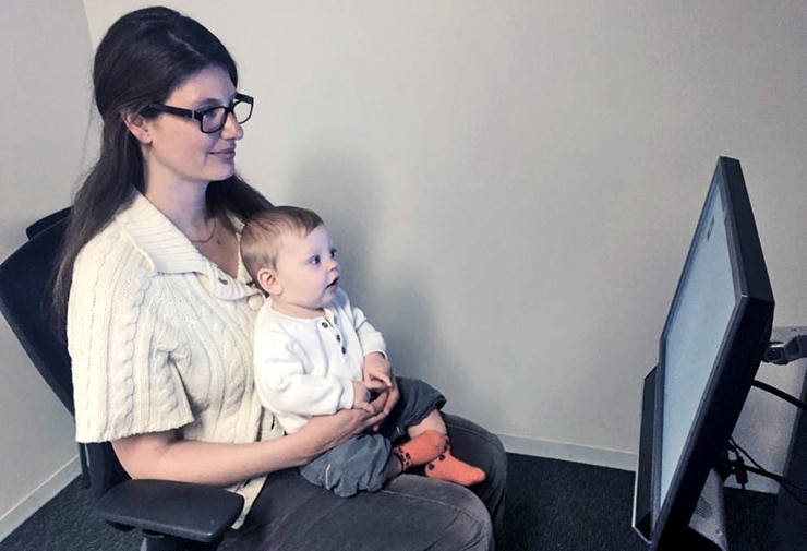 mom and baby participating in face recognition experiment