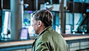 older man, focus on his ear