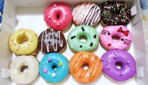 box of donuts with colorful frosting