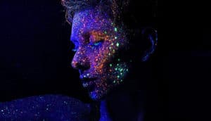 glowing painted face (finding tumors with nanoprobes concept)