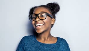 black teen girl smiling (positive racial identity concept)