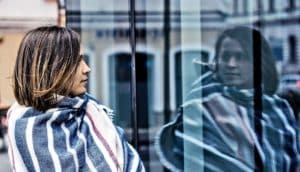 woman seeing reflection (bipolar disorder concept)