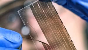 hand peels nanotube fiber off slide