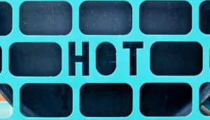 metal grate with the word "hot" in it (rising temperatures concept)