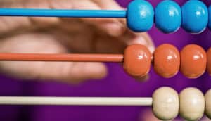 kid using abacus (math + kids concept)