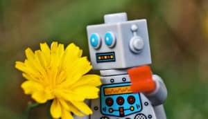 Lego robot smelling flower
