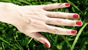 hand with red nail polish