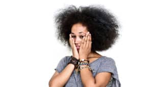 woman with hands on her face