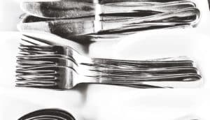 forks and knives on white