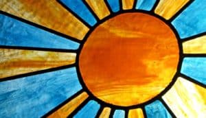 Sun in stained glass (solar cells concept)