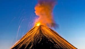 volcano erupting (volcanoes and tidal cycles concept)