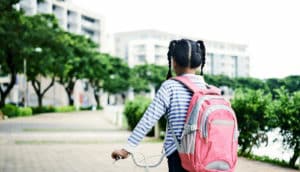 young girl with bike (kids and mental health concept)