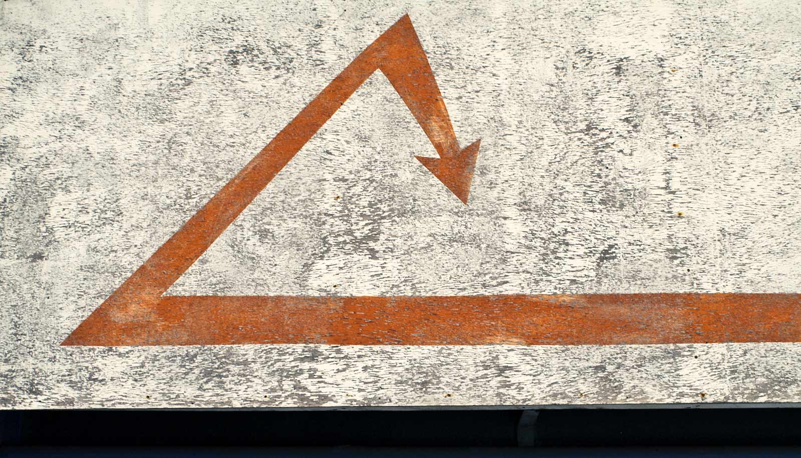 red arrow on a wall