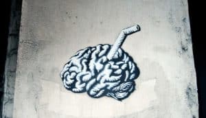 brain with straw (blood-brain barrier + gene therapy concept)