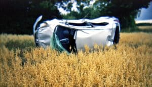 crashed car in field - drivers with dementia