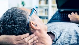 man with hearing aid (hearing loss concept)