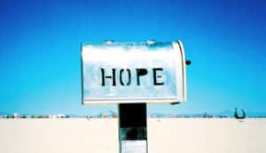 "hope" written on silver mailbox