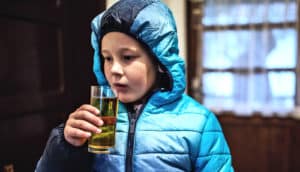 kid sipping beer (alcohol concept)