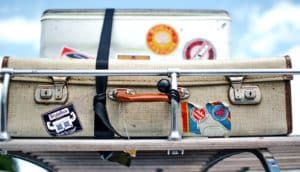 packed suitcase on car (malaria parasite concept)