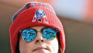 woman in patriots hat and sunglasses