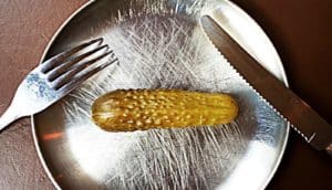 pickle on a metal plate