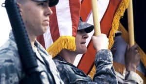 color guard holding flags (US military bases and climate change concept)