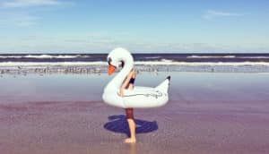 person in swan float at ocean