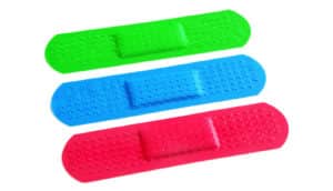 three neon bandaids on white