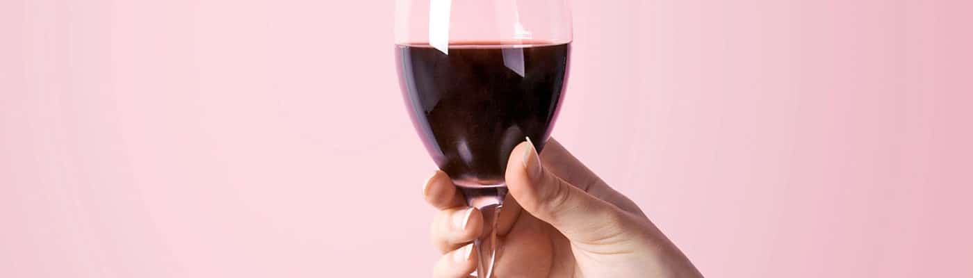 wine glass on pink