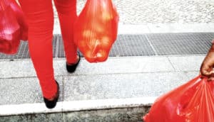 red jeans and red bags of groceries