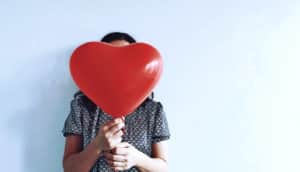 holding heart balloon (heart failure concept)