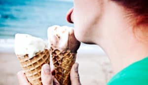 licking two ice cream cones (taste buds and obesity concept)