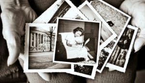 old photos in hands (false memories concept)