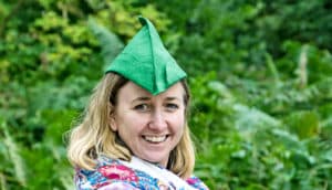 woman in robin hood hat