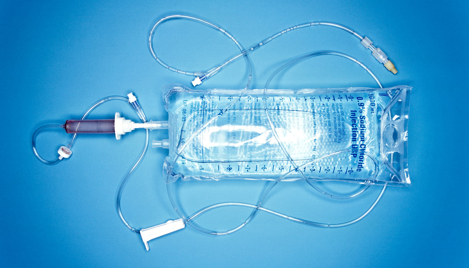 saline IV bag on blue. 