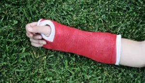 Asthma and broken bones concept; arm in cast