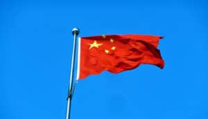 chinese flag against blue (intellectual property theft concept)