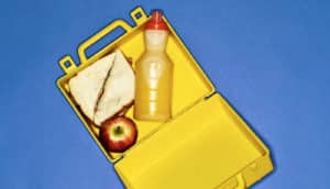 lunchbox on blue background (food allergy concept)