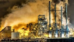 oil refinery at night (climate change concept)