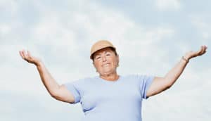 older woman shrugs "sure"