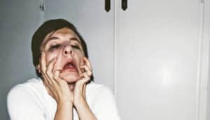 very stressed woman pulls her face - taxes