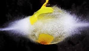 yellow water balloon exploding