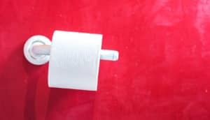 toilet paper roll and red wall
