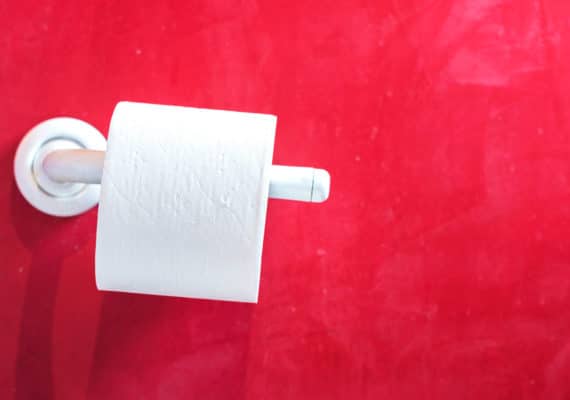 toilet paper roll and red wall