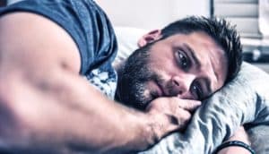 depressed man on bed (depression concept)